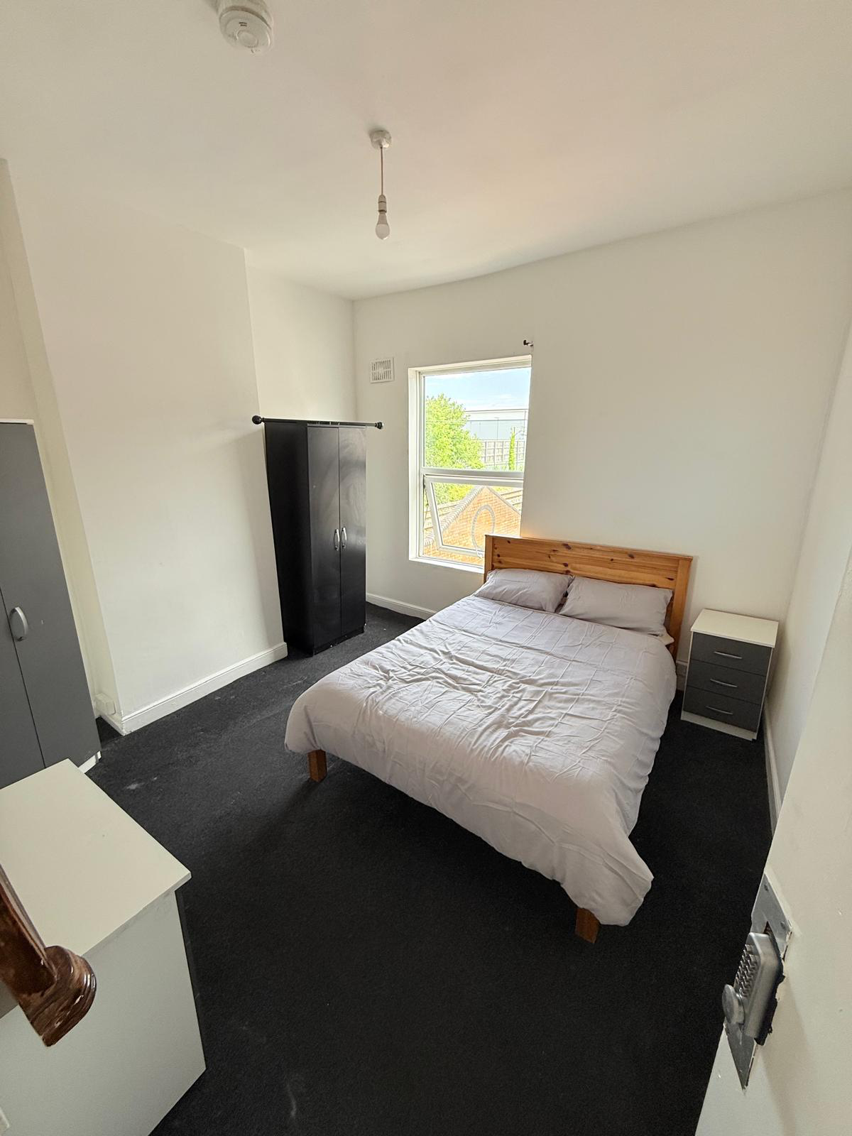 Henswood – Room 2: view from the doorway showing the double bed and window